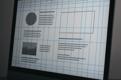 Pantalla con retícula digital visible, contenido editorial alineado con asimetría y tensión visual